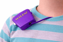 Load image into Gallery viewer, Purple MALEM bedwetting device on a person wearing a striped shirt