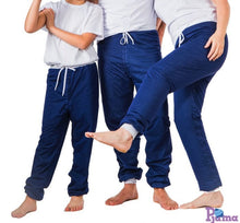Load image into Gallery viewer, Three people wearing matching blue Pjama pants and white shirts on