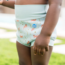 Load image into Gallery viewer, child wearing a otter patterned swimming pants.