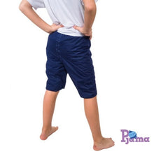 Load image into Gallery viewer, Person wearing blue Pjama  shorts and a white shirt on a white background with 'Pajama' brand logo.
