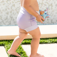 Load image into Gallery viewer, Child wearing light lilac swimming shorts
