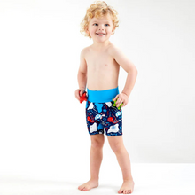 Load image into Gallery viewer, Child wearing colorful swim shorts on a white background
